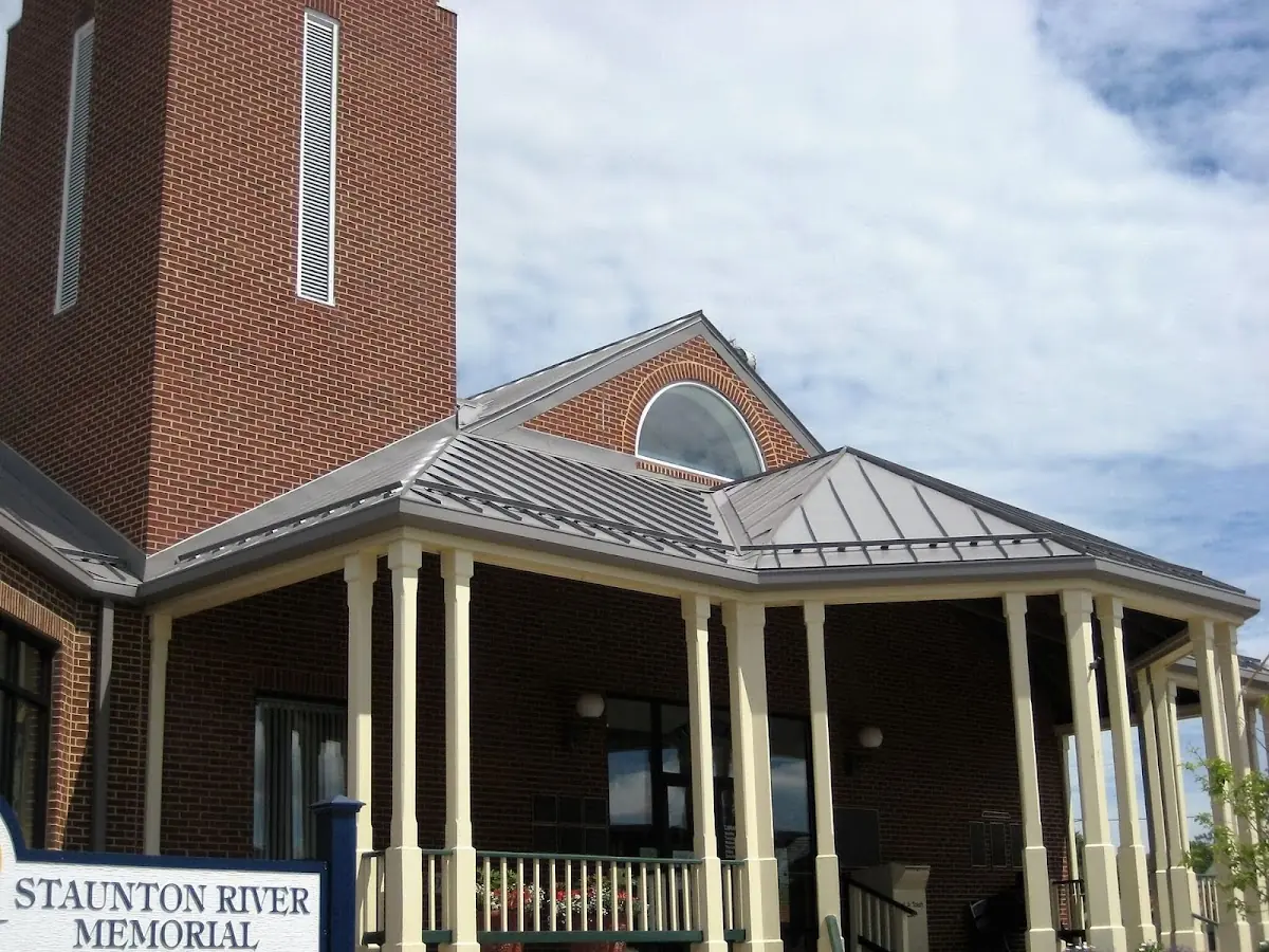 Skilled roofing craftsmen working on a residential roof in Augusta